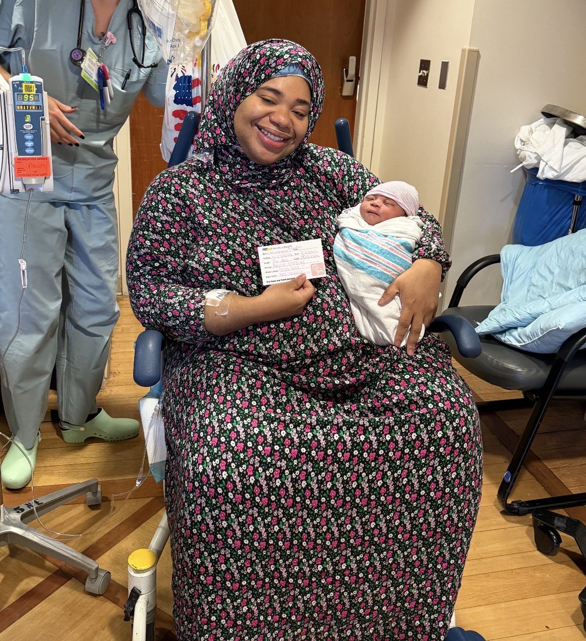 Joyful new mother holding her newborn